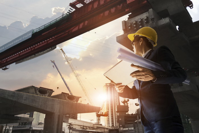 Construction site background. Hoisting cranes and new multi-storey buildings. tower crane and unfinished high-rise building. many cranes. construction of a new district of the city